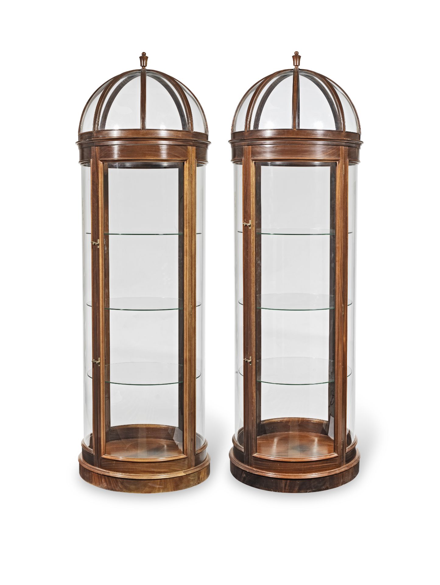 A pair of mahogany domed and cylindrical shop display cabinets (2)