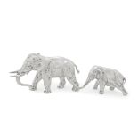 A cast silver elephant and calf maker's mark Ss, London 1977 and Jabeh Investment Co Ltd, Londo...