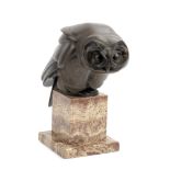 An early 20th century patinated bronze model of a stylised tawny owl probably German, circa 1930