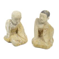 A pair of 19th century Burmese carved sandstone figures of monks (2)