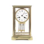 An early 20th French brass four glass mantel clock the movement stamped Hy Marc, Paris