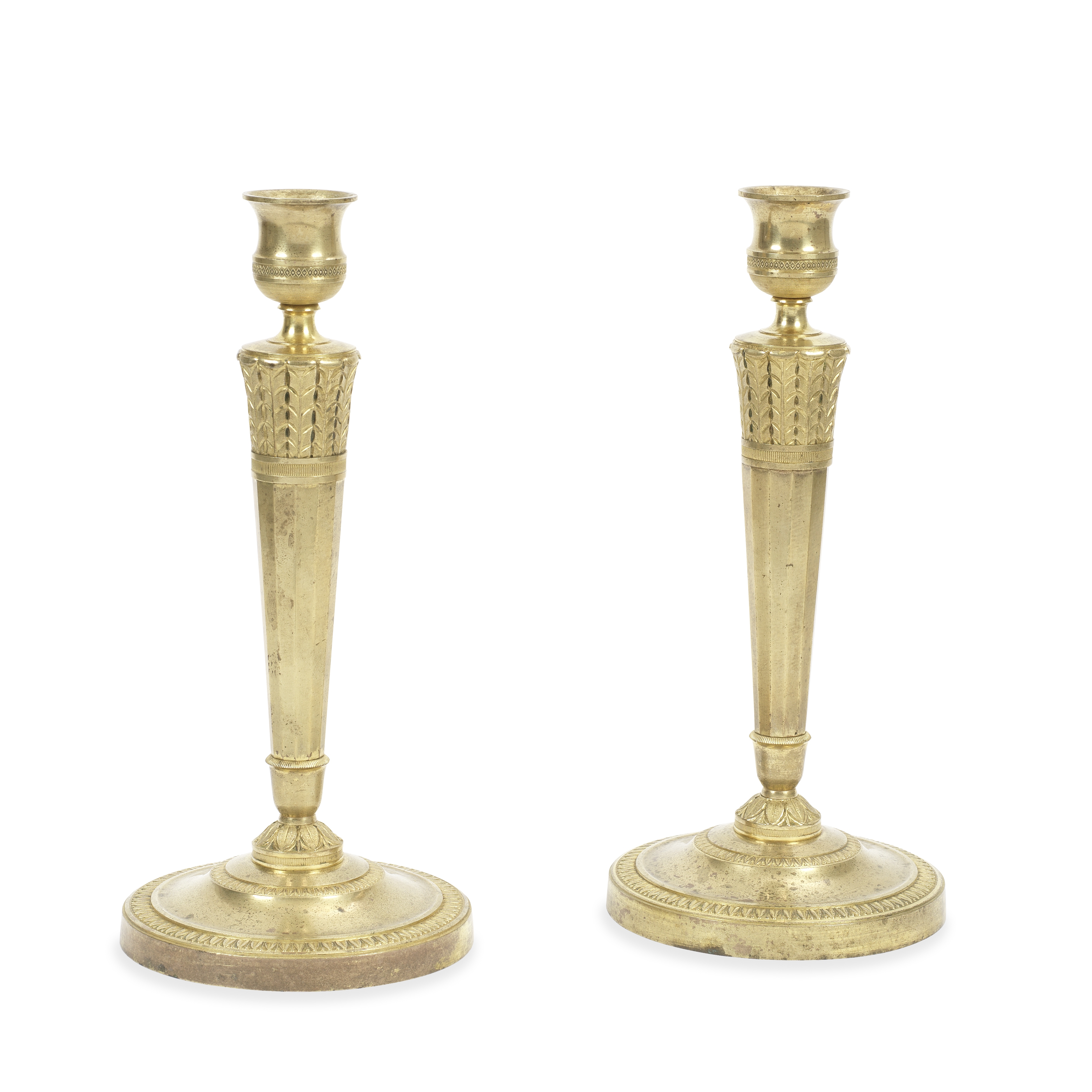 A pair of Directoire gilt bronze candlesticks (2)