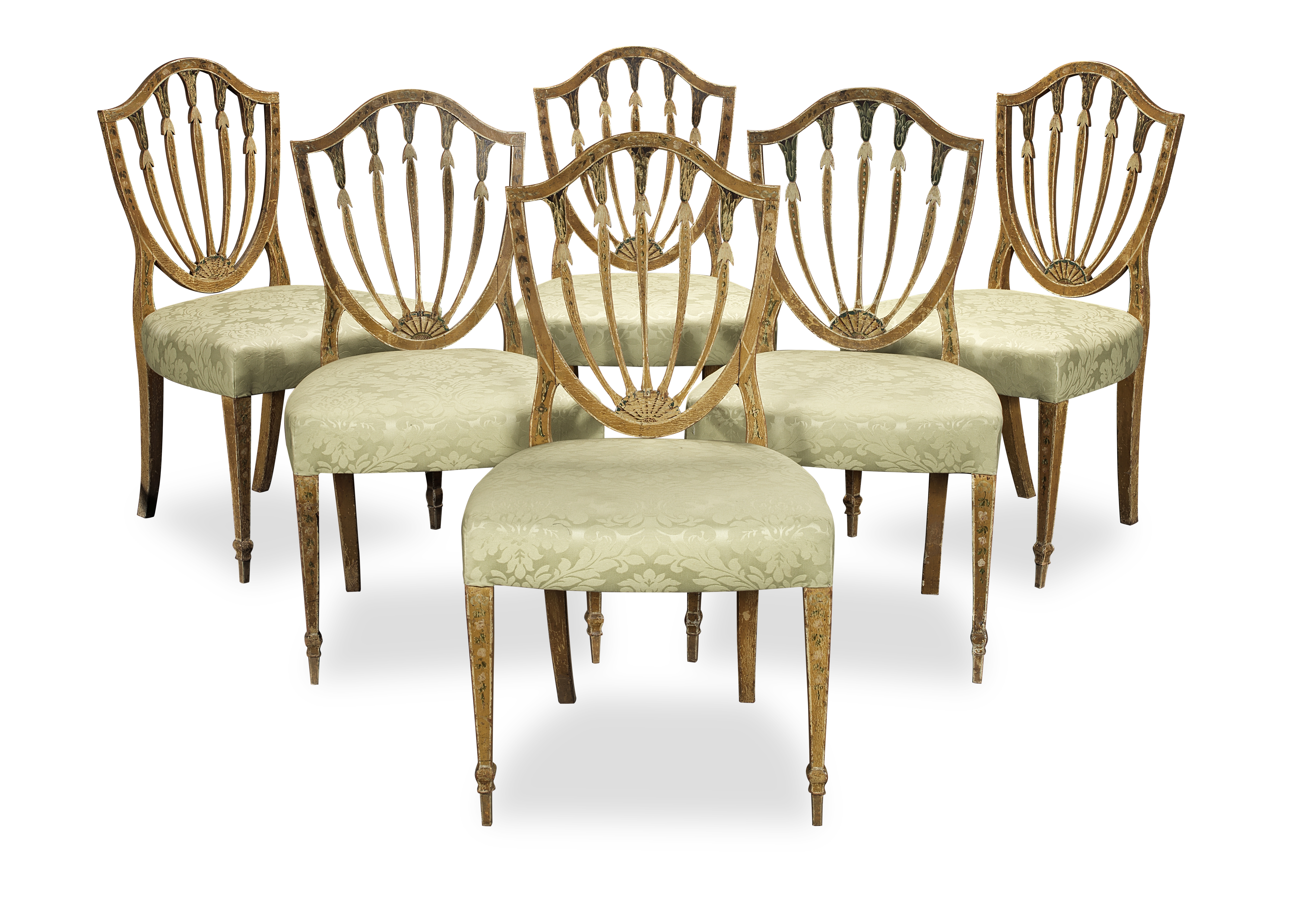 A set of six George III polychrome decorated dining chairs Circa 1785, after a design by Gillows...