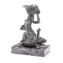 A late 19th century patinated bronze figural group of a triton and infant riding on a tortoise i...