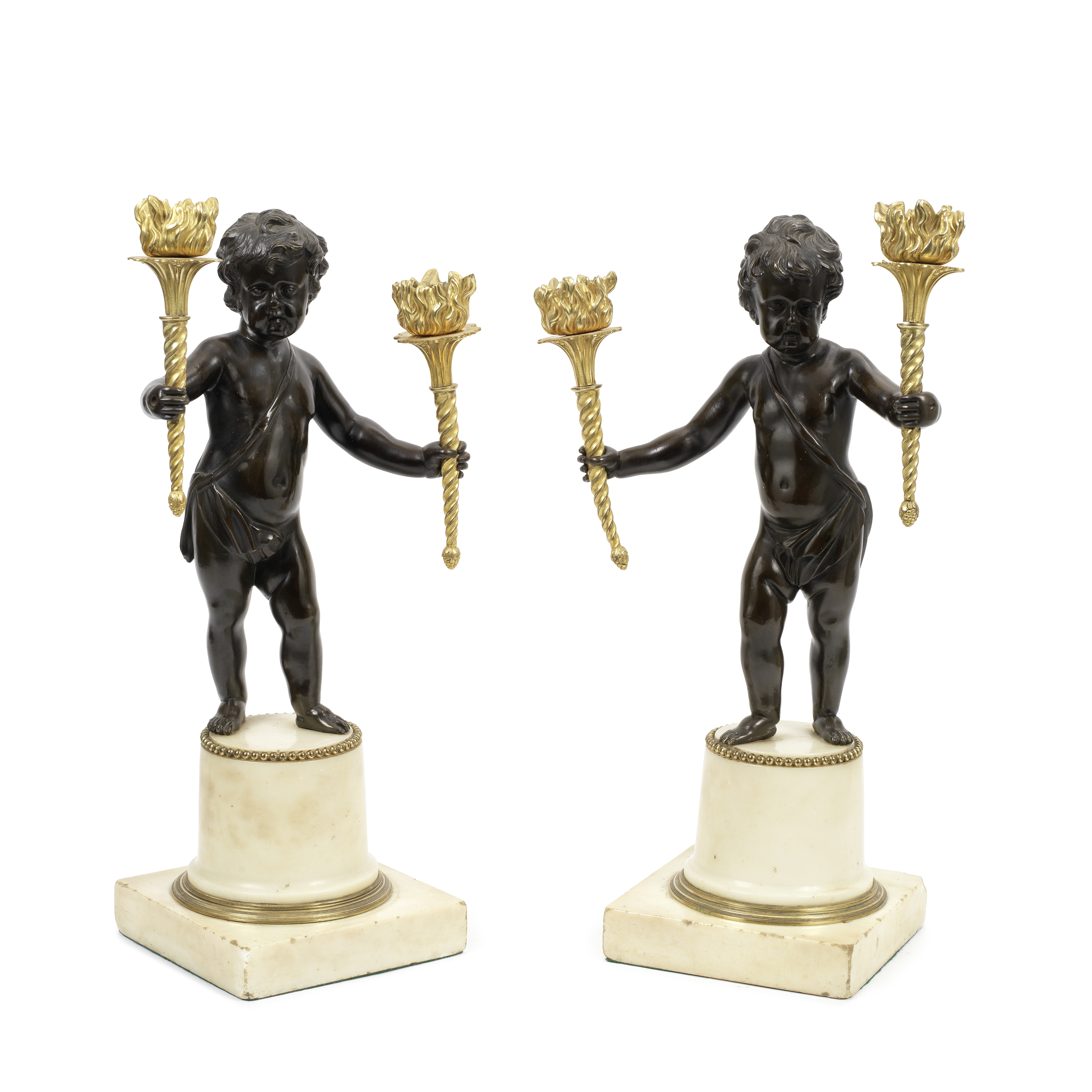 A pair of 19th century French patinated and gilt bronze and white marble figural twin-light cand...