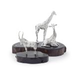 PATRICK MAVROS: two silver sculptures, one of a seated and standing giraffe the other of an ante...