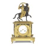 An Empire gilt and patinated bronze figural mantel clock depicting the Abduction of Hippodamia