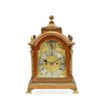 An early 20th century gilt brass mounted oak table clock in the George III style