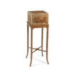 An Edwardian satinwood and ivory line-inlaid portable dressing table or necessaire on stand by C...