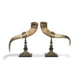 A pair of late 19th Century patinated and polished brass and copper mounted cow horn garniture o...