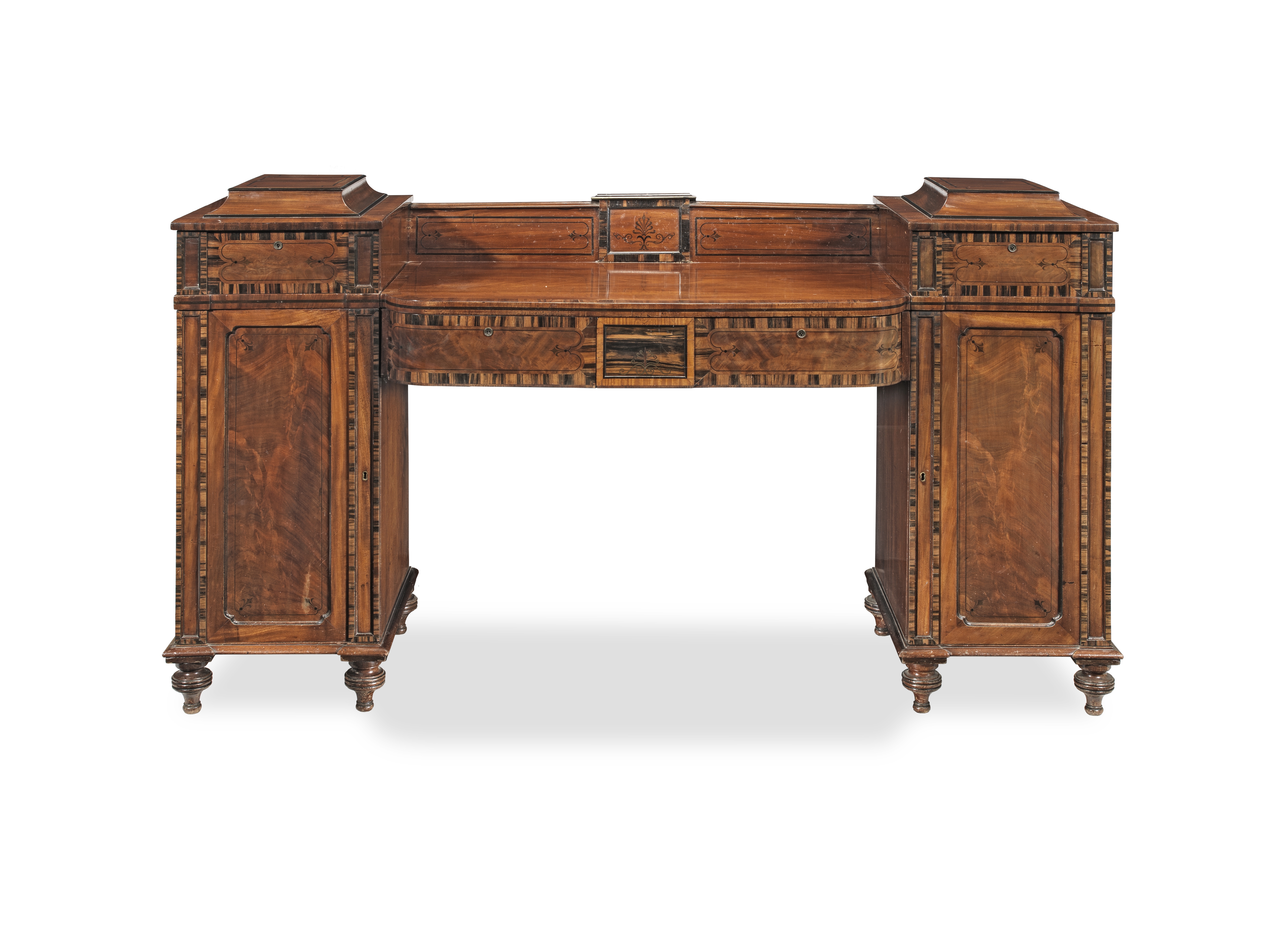 A Regency mahogany, calamander and ebonised inlaid pedestal sideboard in the manner of George Oa...