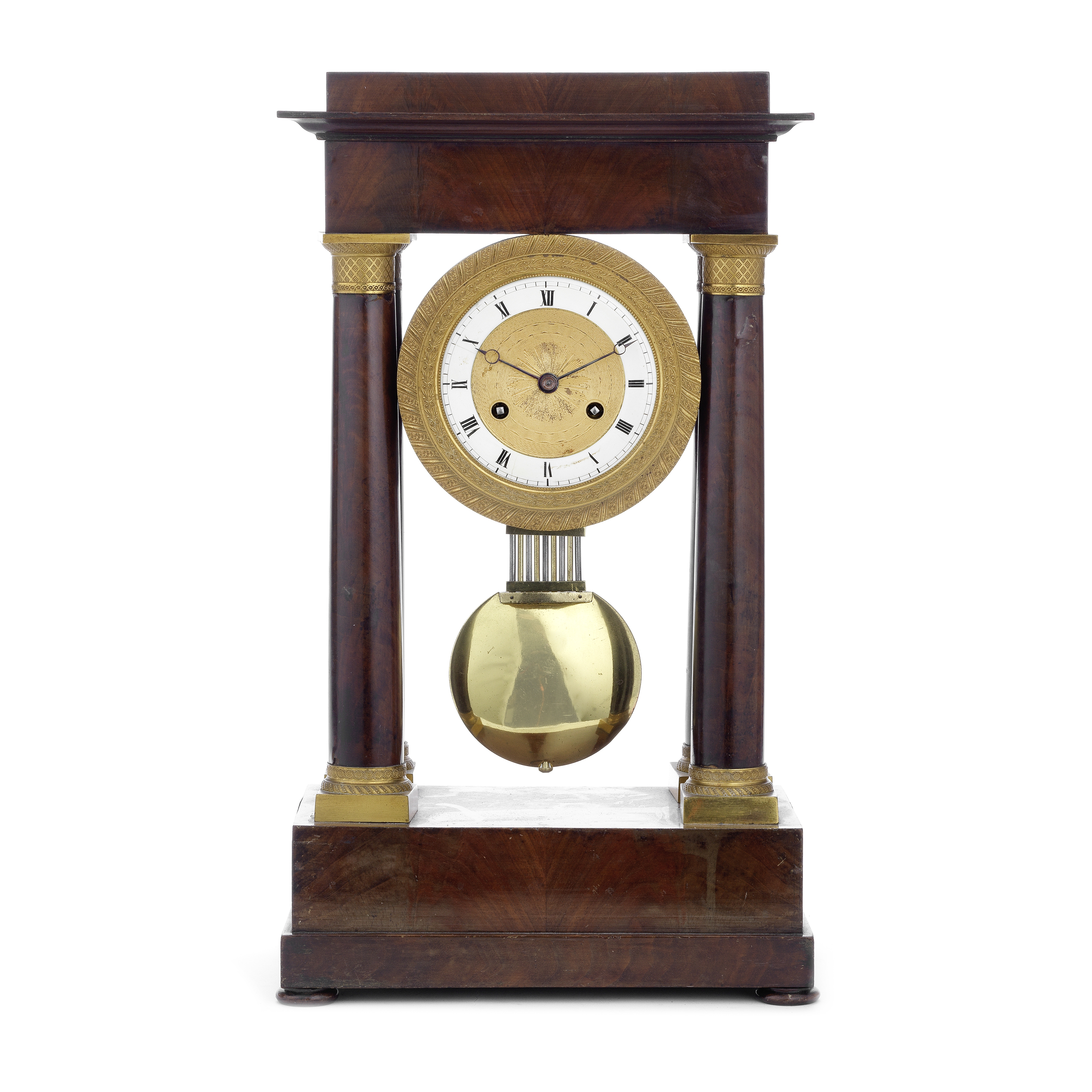 A mid 19th century French gilt bronze mounted mahogany portico clock