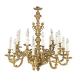 A late 19th/early 20th century French gilt bronze eighteen-light chandelier in the R&#233;gence ...