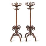 A pair of early 20th century brass mounted stained beech bentwood hall stands (2)