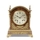 An early 20th century German walnut and gilt mounted German table clock with ting-tang striking ...