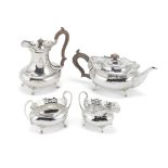 A silver four-piece tea and coffee service, with fitted box on stand Hamilton & Co of Calcutta,...