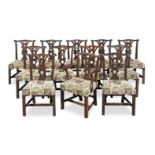 A matched set of twelve carved mahogany dining chairs at least five of the chairs are late 18th...