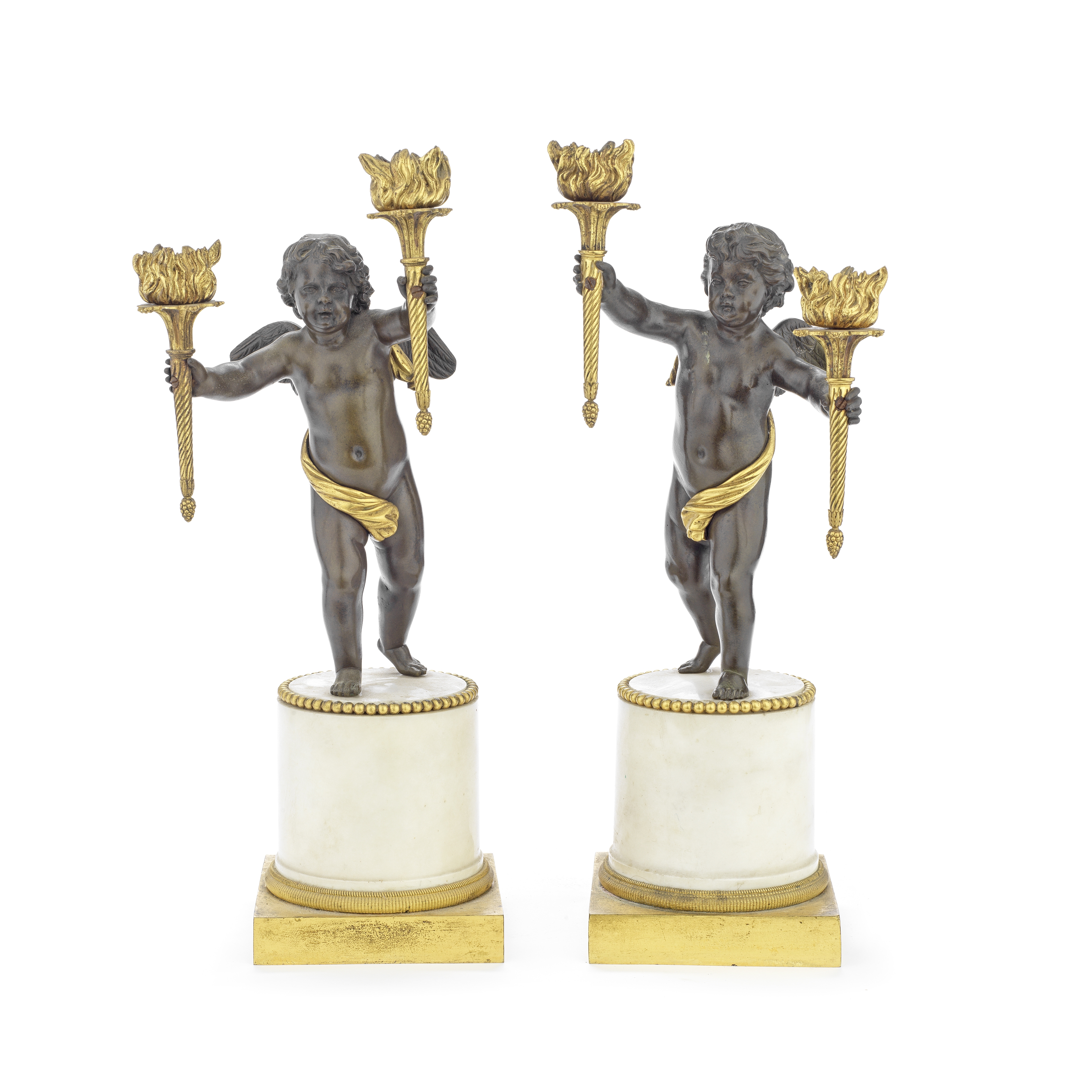 A pair of 19th century French patinated and gilt bronze and white marble figural twin-light cand...