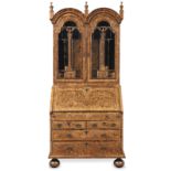 An impressive Queen Anne or George I burr walnut, figured walnut and featherbanded bureau cabine...