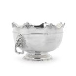 A monumental Edwardian silver two-handled bowl in the form of a Monteith Charles Stuart Harris, ...