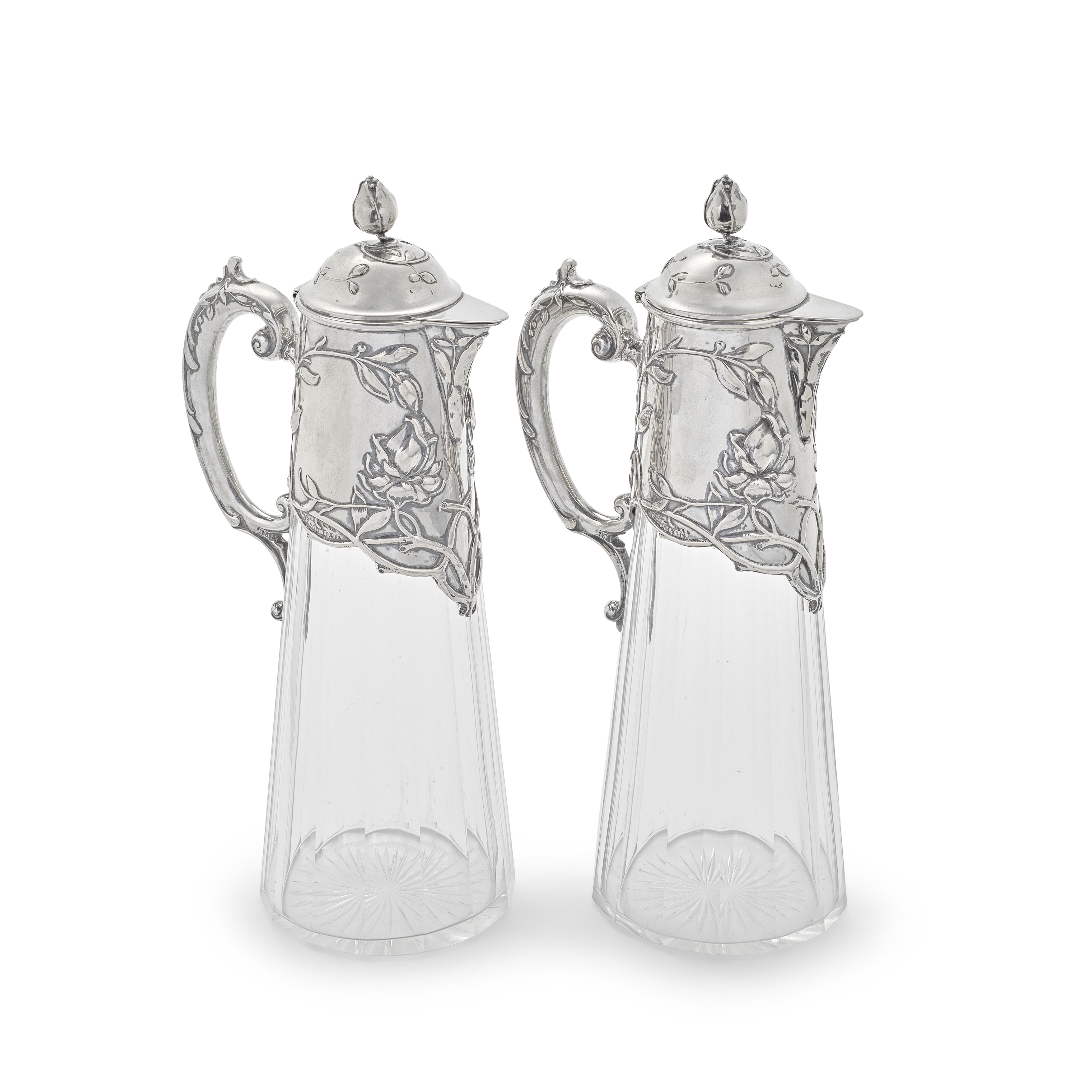 A pair of German 'Jugendstil' silver-mounted cut-glass claret jugs possibly Koch & Bergfeld, Bre...