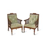 A pair of mid Victorian mahogany bergeres in the George III style (2)
