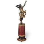 A late 19th century Venetian carved wood and polychrome decorated figure of a Moorish dancer rai...