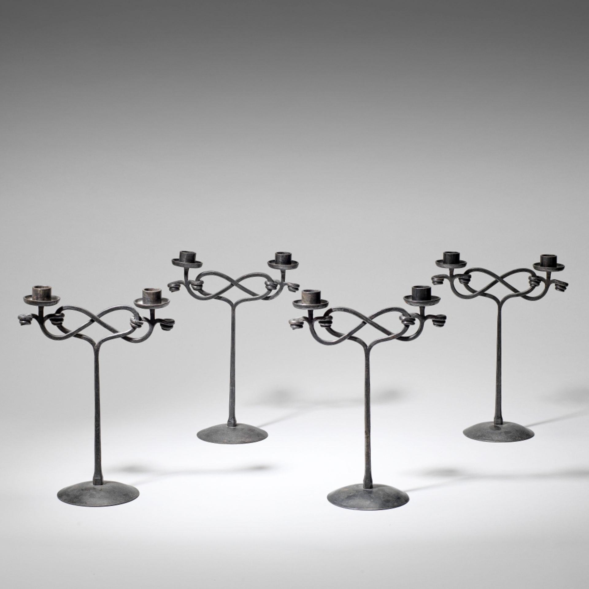 Edward Spencer Set of four twin-branch candelabra, circa 1910