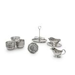 Silver dishes comprising eleven finger bowls, two sauceboats and a cruet stand, added to this a ...