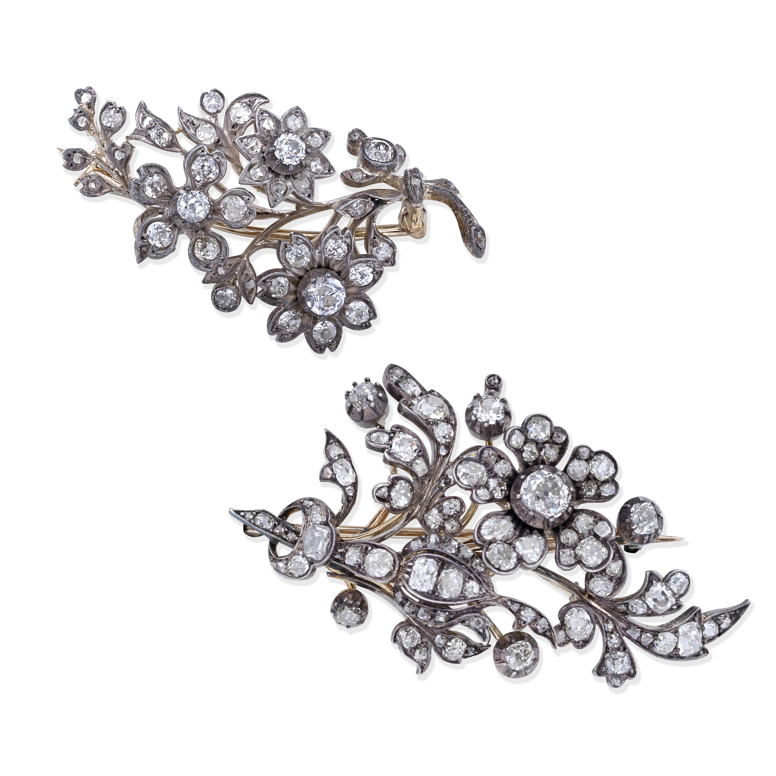 TWO DIAMOND FLORAL BROOCHES, (2)