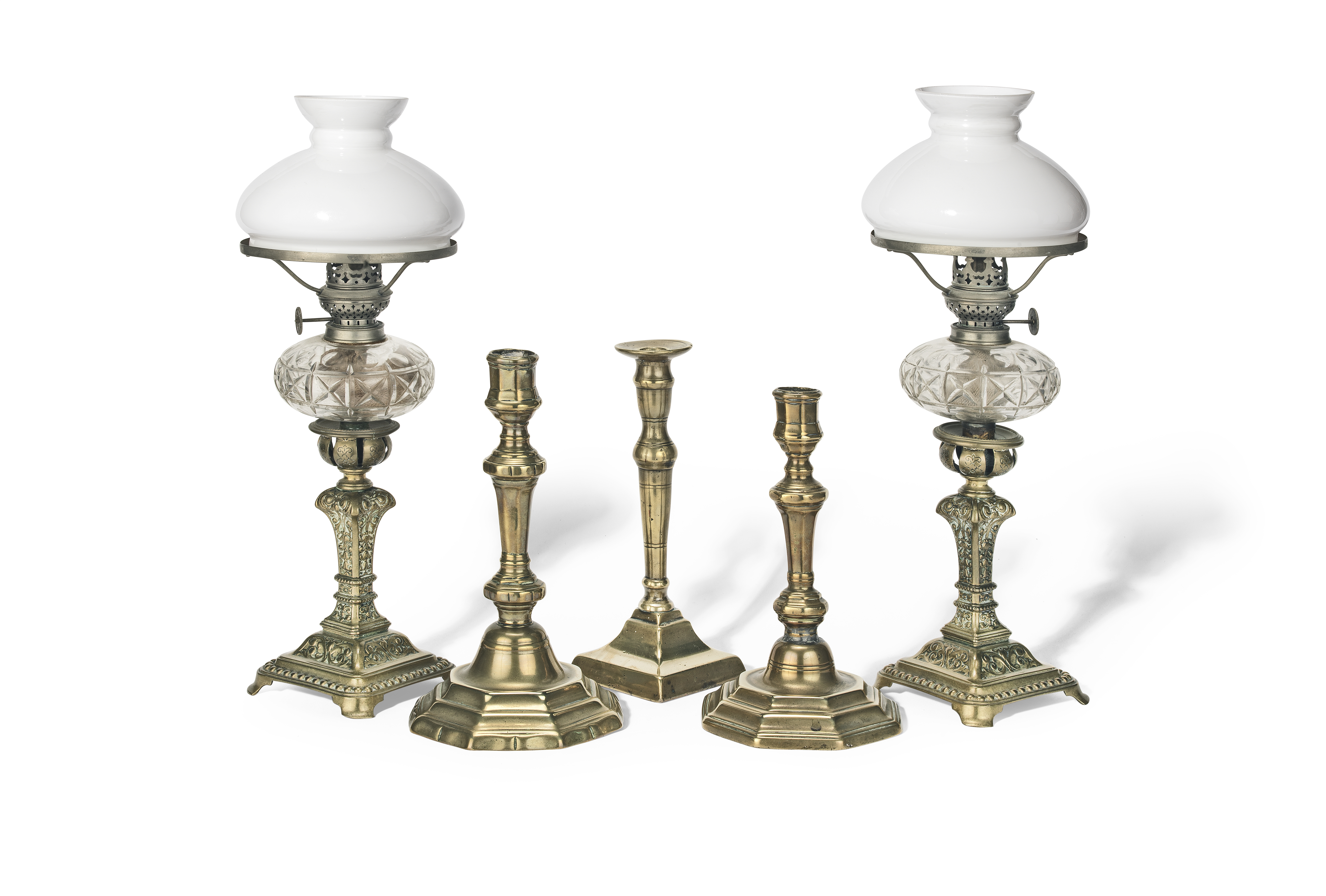A collection of three early 18th century brass candlesticks (5)