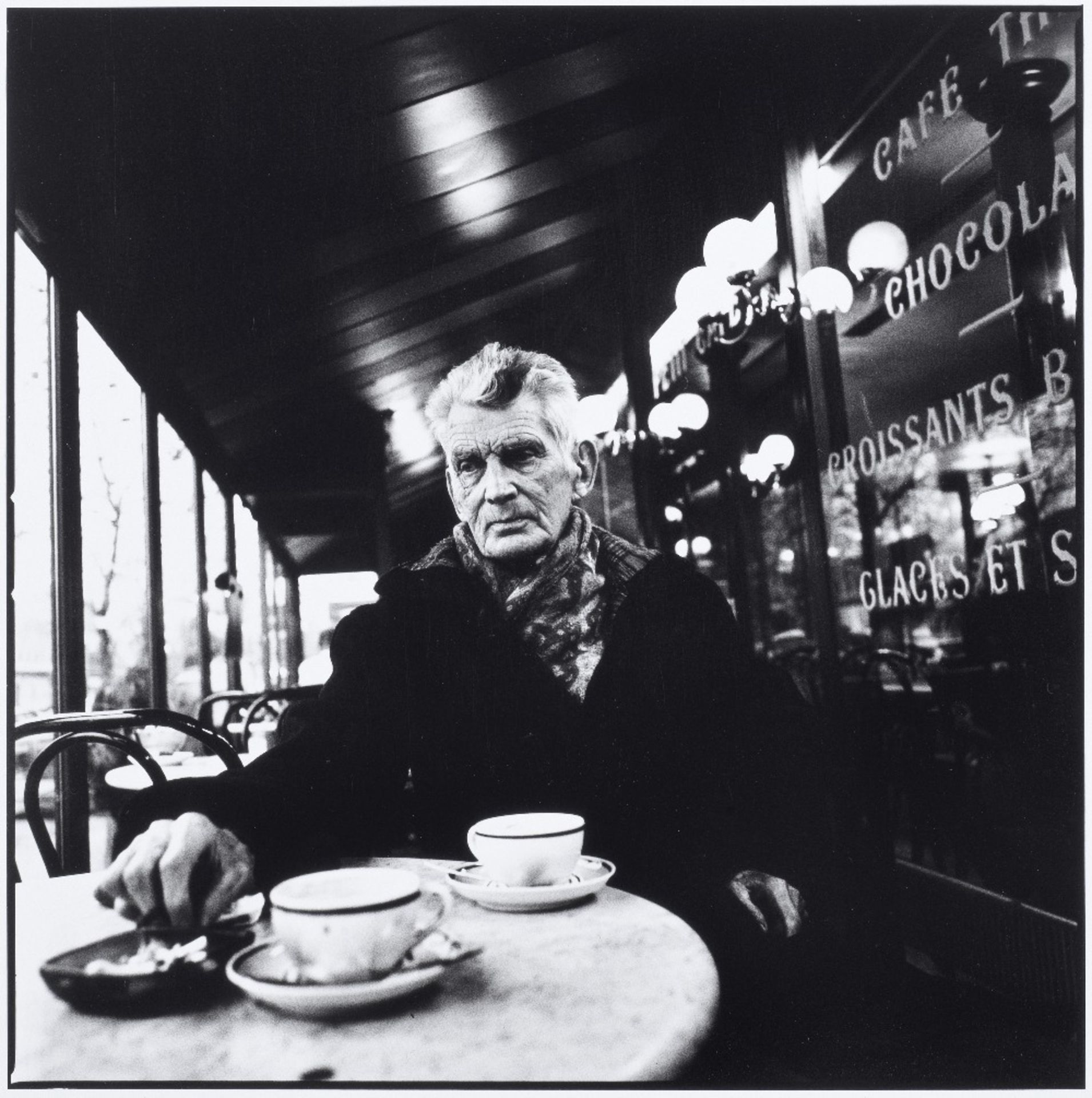 BECKETT (SAMUEL) MINIHAN (JOHN) Samuel Beckett photographed in Caf&#233; Fran&#231;ais, Boulevar...