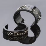 Christian DIOR, Collection Pr&#234;t &#224; Porter, circa 2000. Deux bracelets joncs de tailles ...