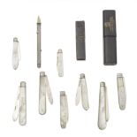 A collection of over thirty folding silver and mother-of-pearl pocket/fruit knives and silver mi...