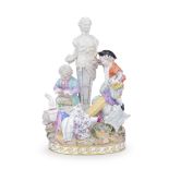 A late 19th century Meissen porcelain and outside decorated figural group of three children