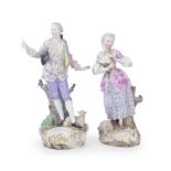 A matched pair of late 19th century Meissen porcelain figures of a shepherd and shepherdess