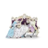 A late 19th century Meissen porcelain figural group of a courting couple seated on a sofa in the...