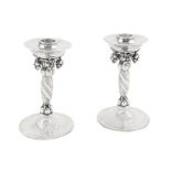 GEORG JENSEN: a pair of Danish silver 'Grape' pattern candlesticks post 1945 mark, also stamped ...