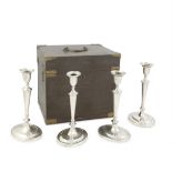 A set of four George III silver candlesticks, in a fitted box John Green, Roberts, Mosley & Co, ...