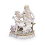 A late 19th century Meissen porcelain figural group of three putti emblematic of literature in t...