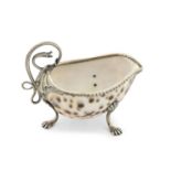 A silver mounted cowrie shell sauce boat unmarked, probably George III circa 1760