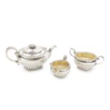 A George III silver three-piece tea service maker's mark IW, possibly John Wakefield, London 181...