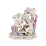 A late 19th century Meissen porcelain figural group of three putti emblematic of painting in the...