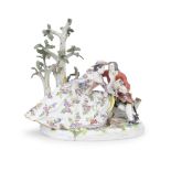 A late 19th/early 20th century Meissen porcelain figural group of a courting couple in the 18th ...