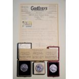 Three boxed silver medals with signed letter on Godfrey's headed notepaper & Isle of Man stamp