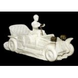An Alabaster statue of an early motor car, ((2))