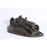 A pewter desk set in the form of an Edwardian car at speed,