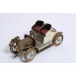 A motoring desk piece in the form of a two-seat open tourer, circa 1904, probably Swiss,