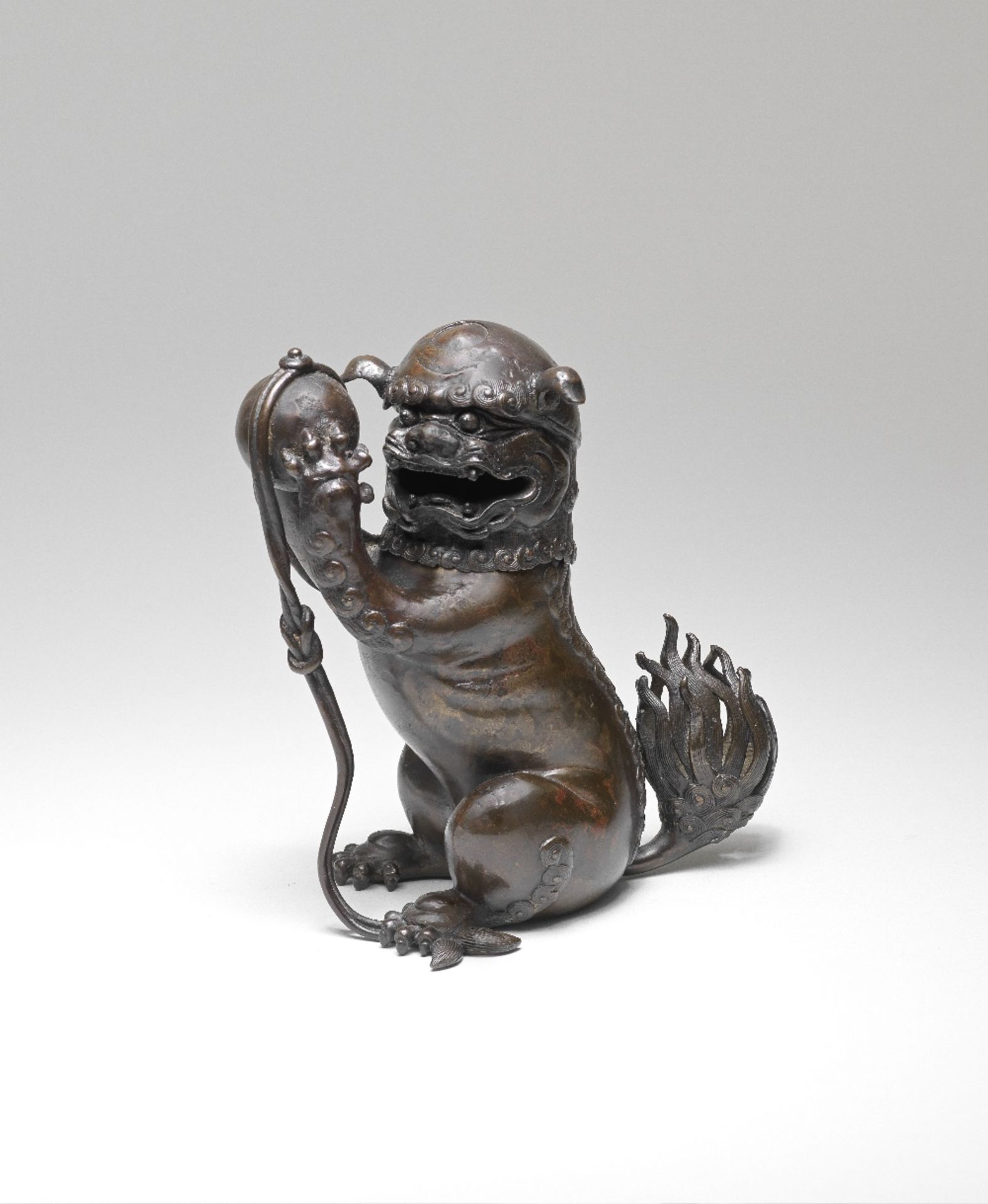 A BRONZE 'BUDDHIST LION' INCENSE BURNER AND COVER 17th century (2)