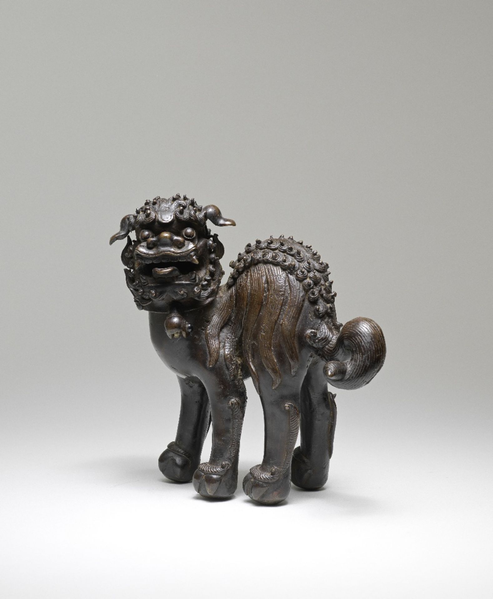 A BRONZE 'BUDDHIST LION' INCENSE BURNER AND COVER 17th century (2)